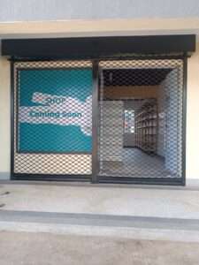 Heavy-duty steel roller shutter securing warehouse entrance in kenya east africa