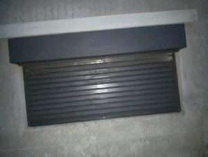 Heavy-duty steel roller shutter securing warehouse entrance in kenya east africa