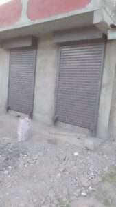Heavy-duty steel roller shutter securing warehouse entrance in kenya east africa