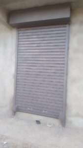 Heavy-duty steel roller shutter securing warehouse entrance in kenya east africa